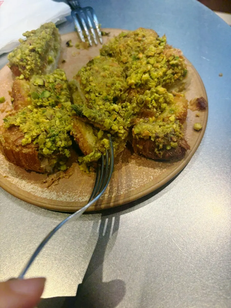 Cross-section of the pistachio croissant cut with a knife