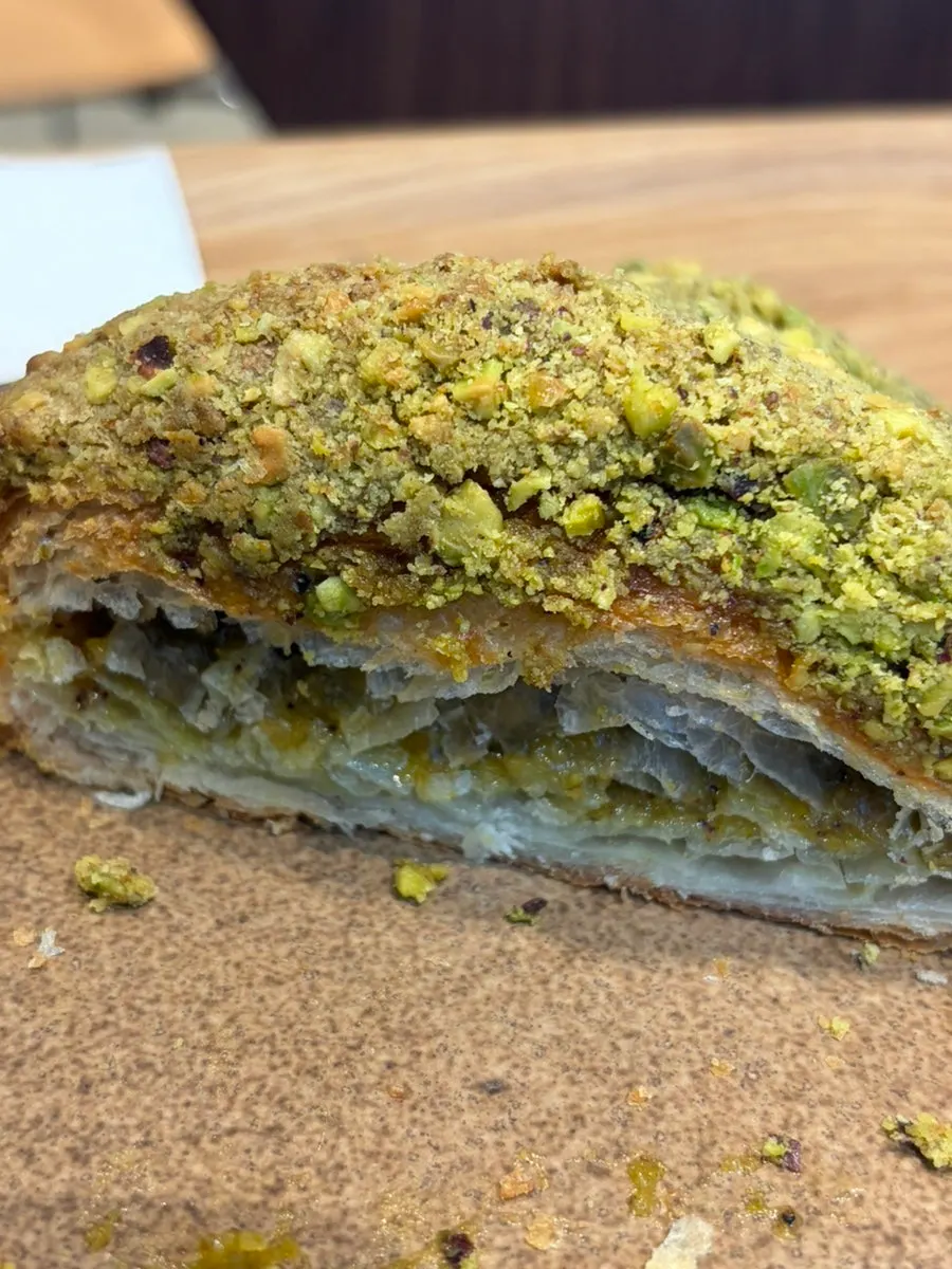 Cross-section of the pistachio croissant, packed with filling