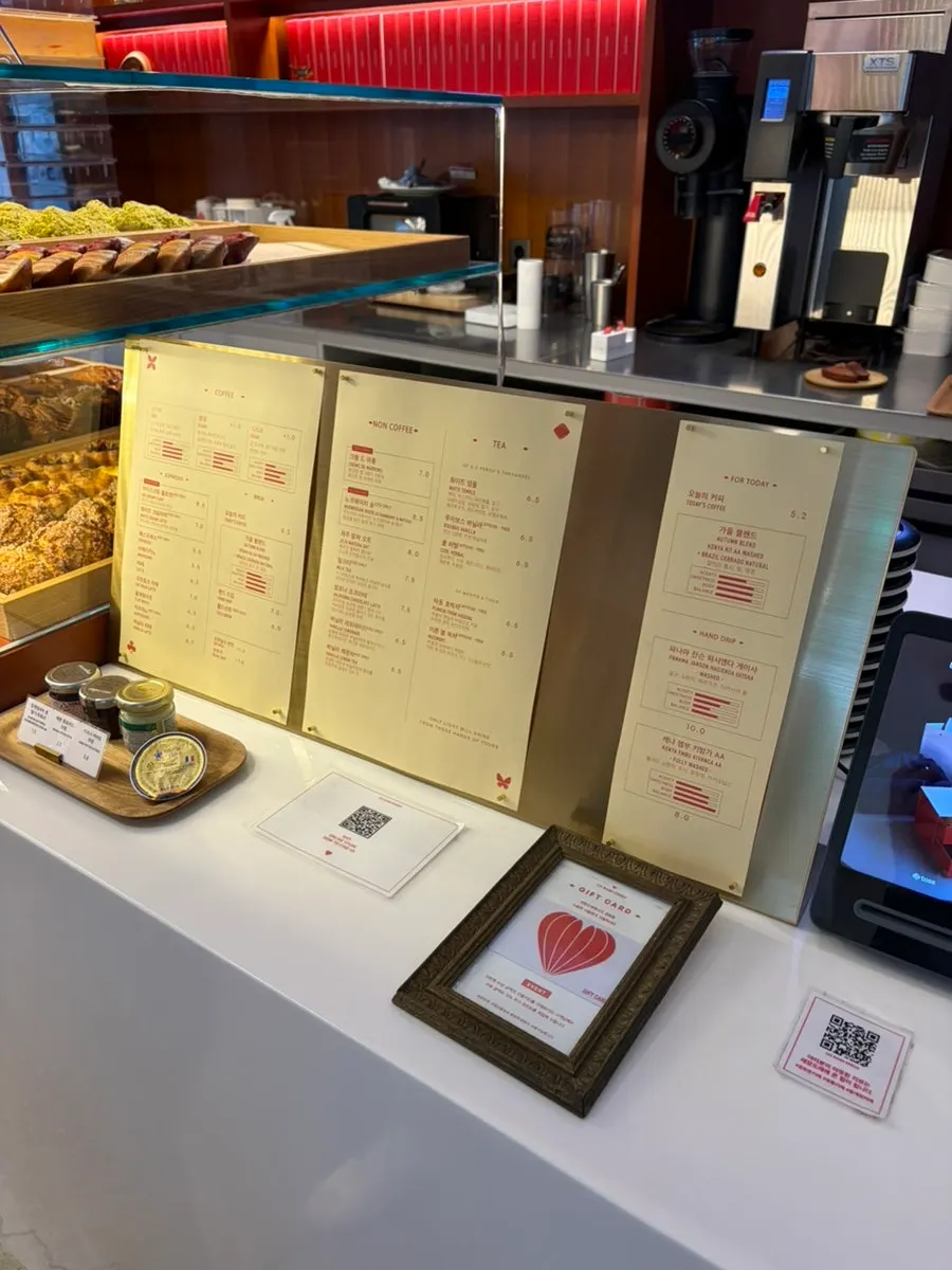 Display case with madeleines, scones, pies and tarts