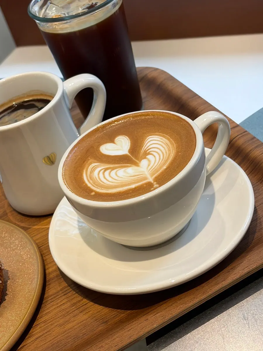 Hot latte, Americano and butter scone set on the table