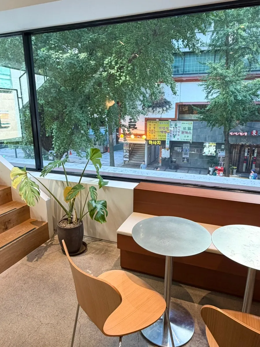 2nd floor seating with natural light through large windows