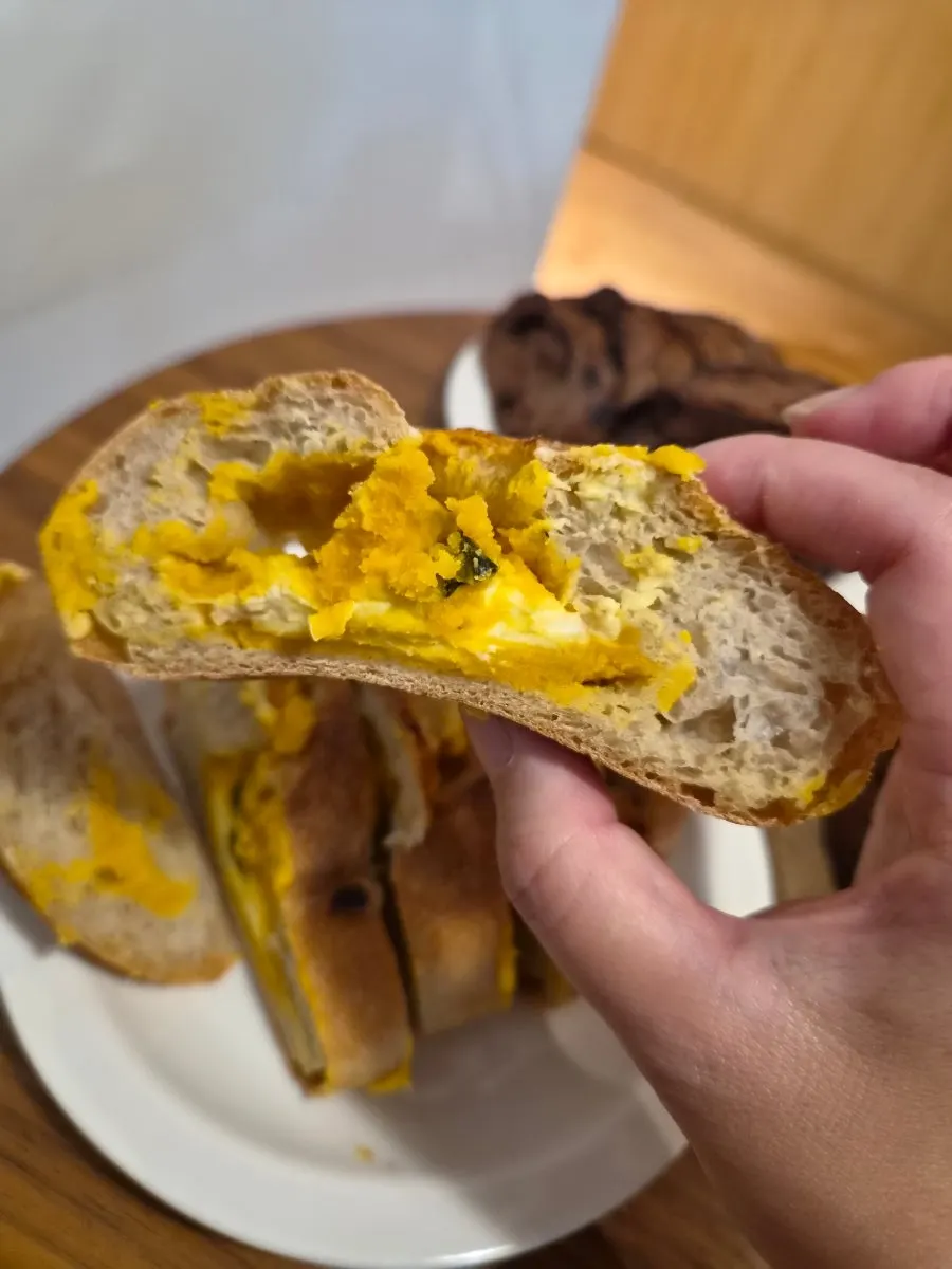 Cross-section of the country bread showing cream cheese