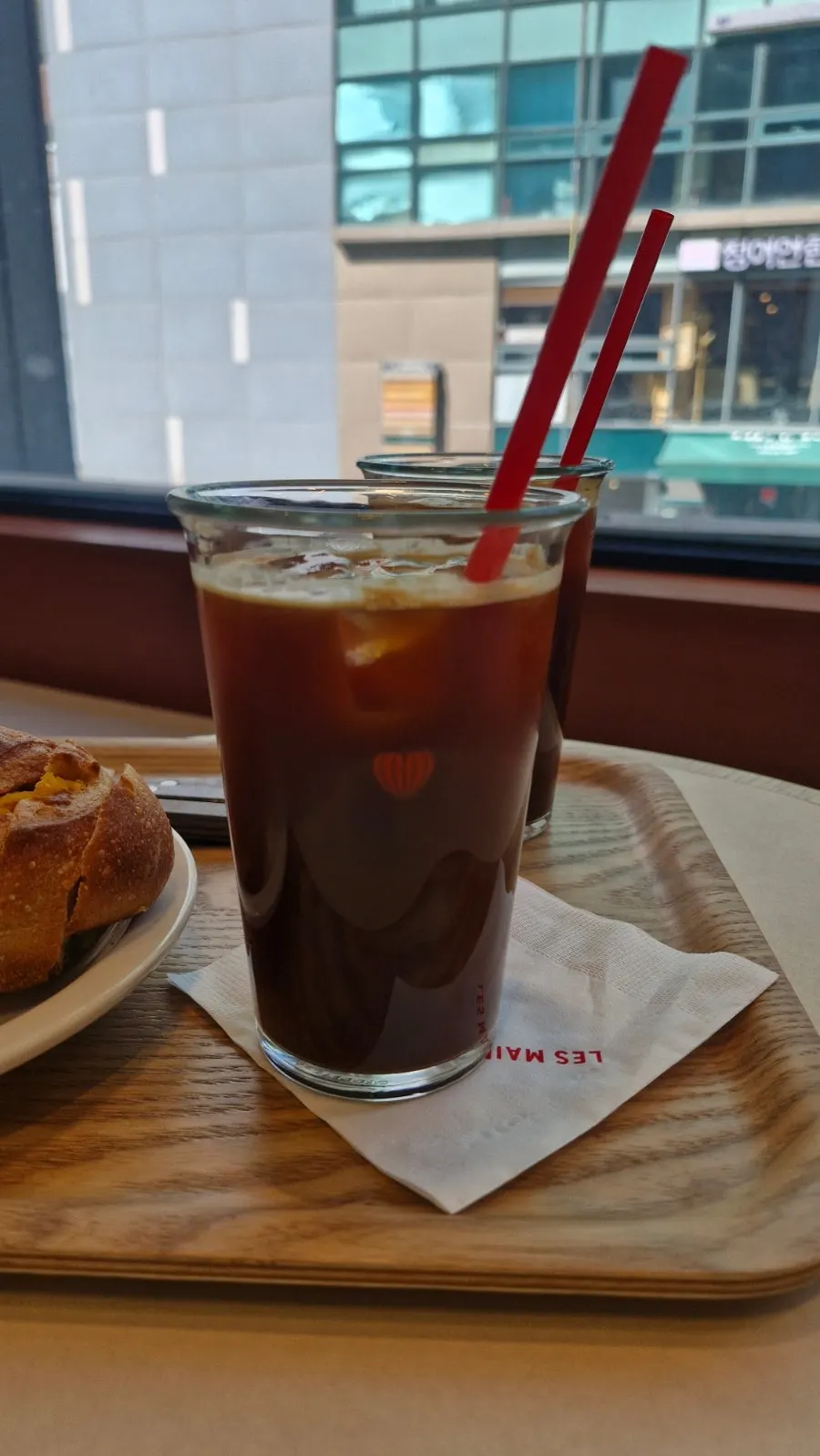 Iced Americano served alongside the bread
