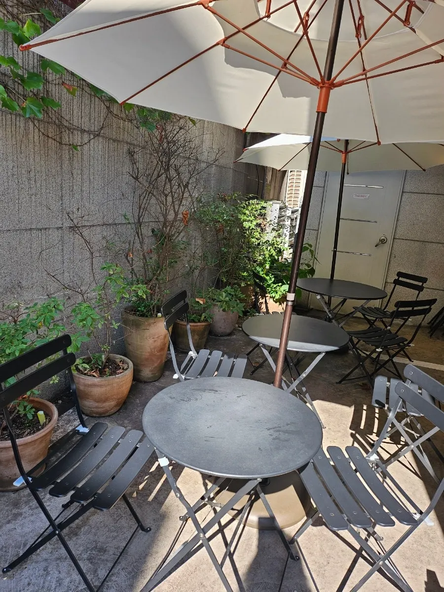 Outdoor terrace seating with parasols at Remangdore