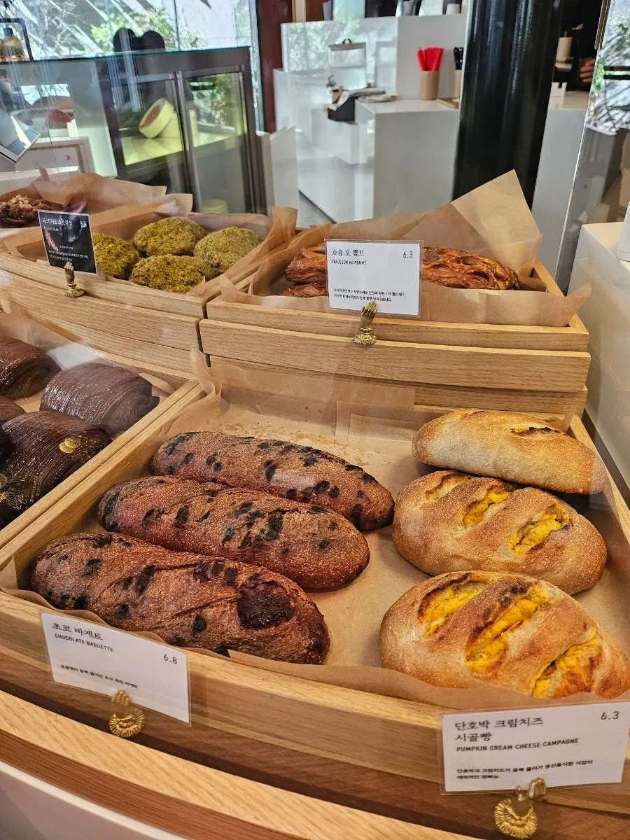 Display case with chausson aux pommes and choco baguette