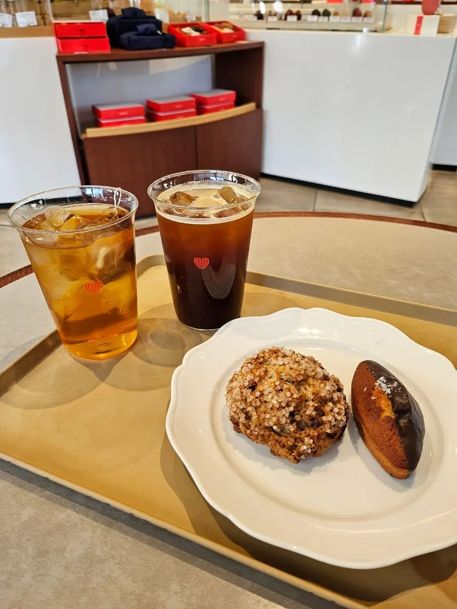 Caramel pecan scone and drink on a tray