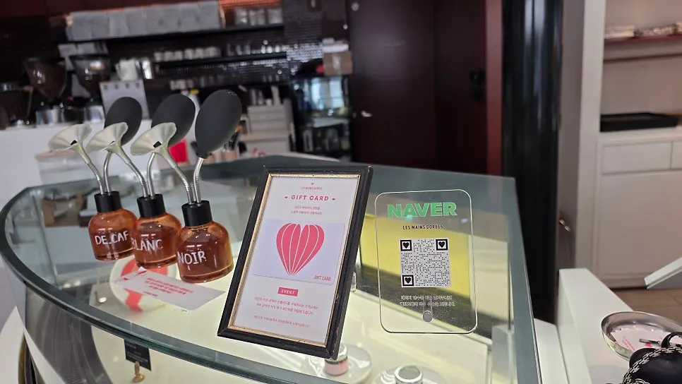 Drink menu board showing the coffee of the day price