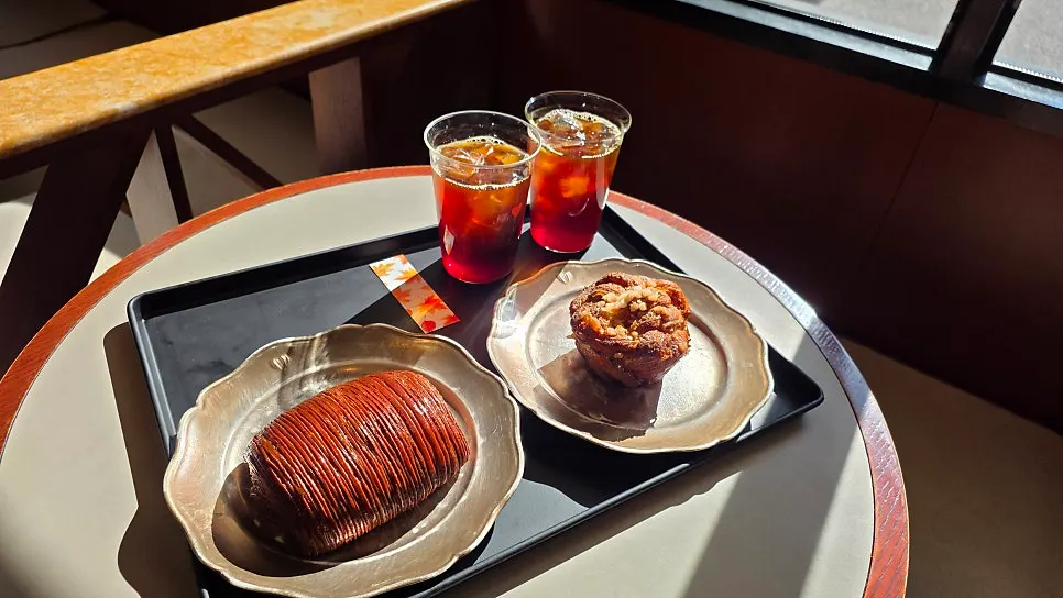Ordered coffee and dessert on a window table