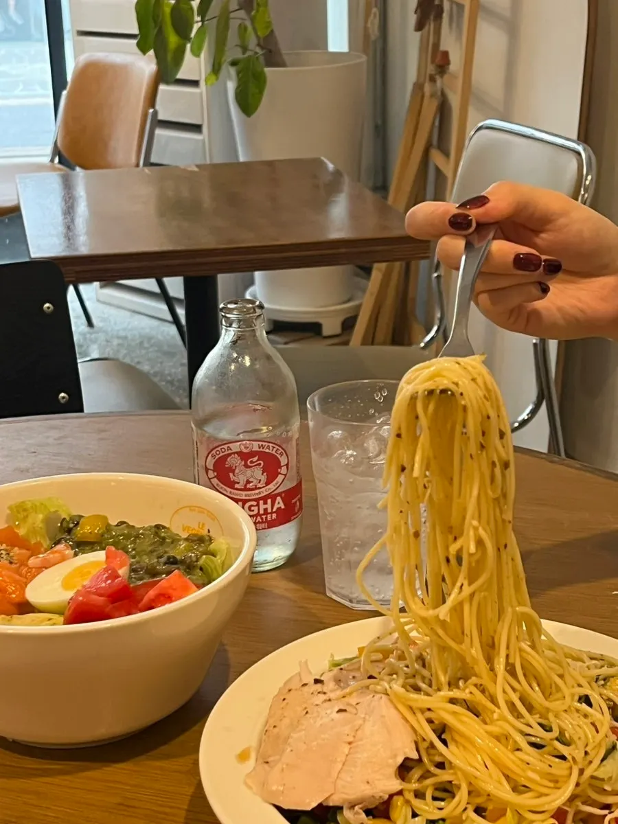 Forkful of salad pasta being lifted