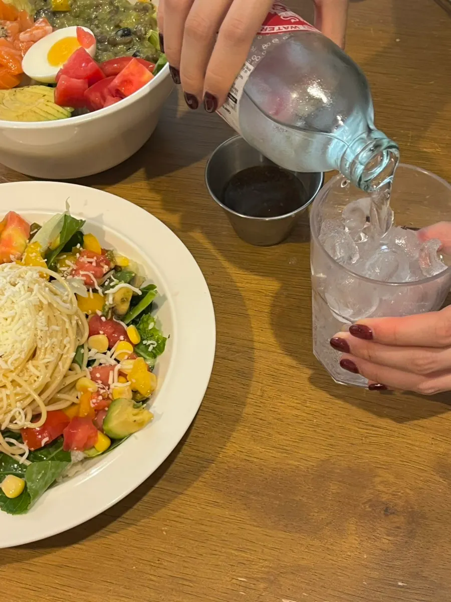 Singha sparkling water ordered at Le Vegie Wang