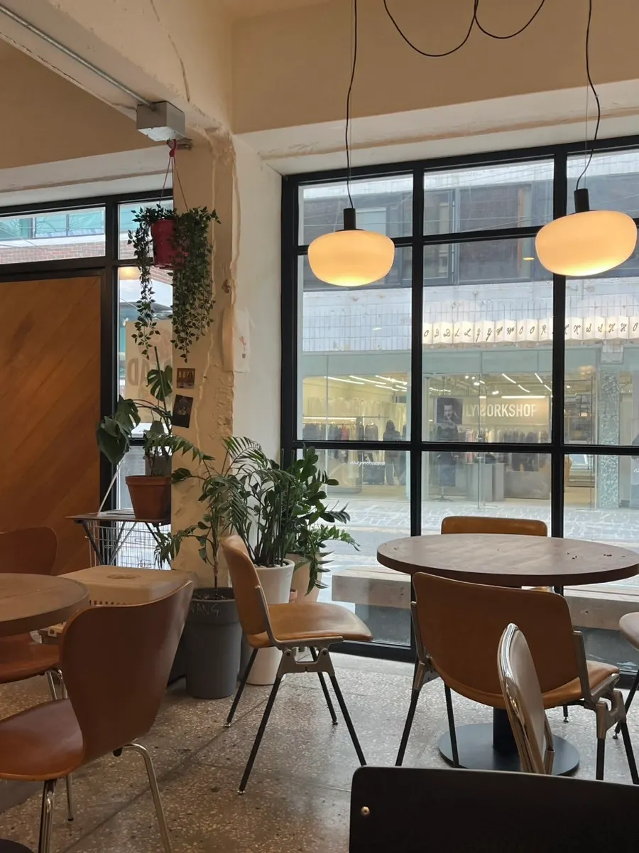 Dining table with a window view at Le Vegie Wang Seongsu Space