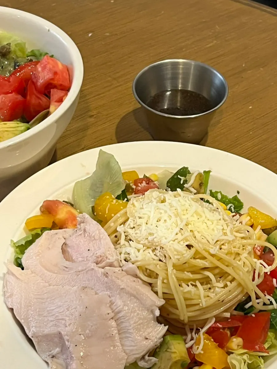 Tender chicken breast topping the salad pasta