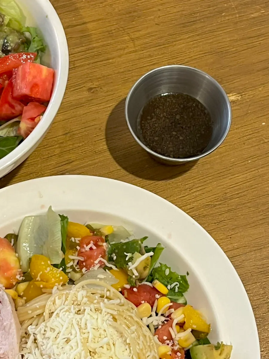 Chicken breast and dressing on the salad pasta