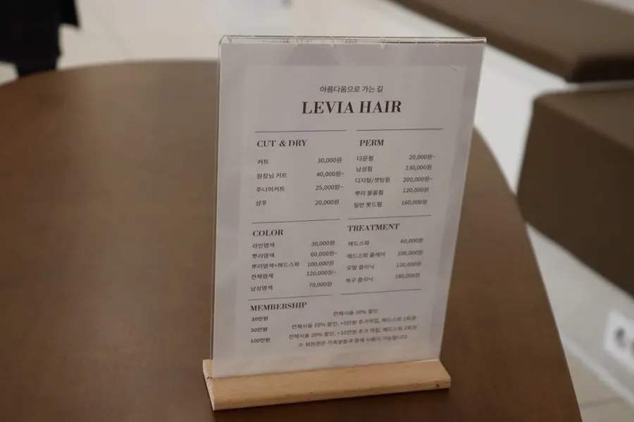 Checking hair condition during the color consultation
