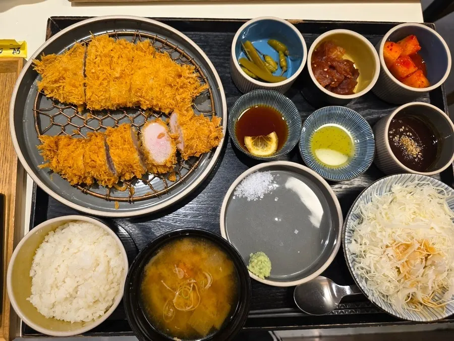 Table spread with cold soba roseu set, hire-katsu, and curry