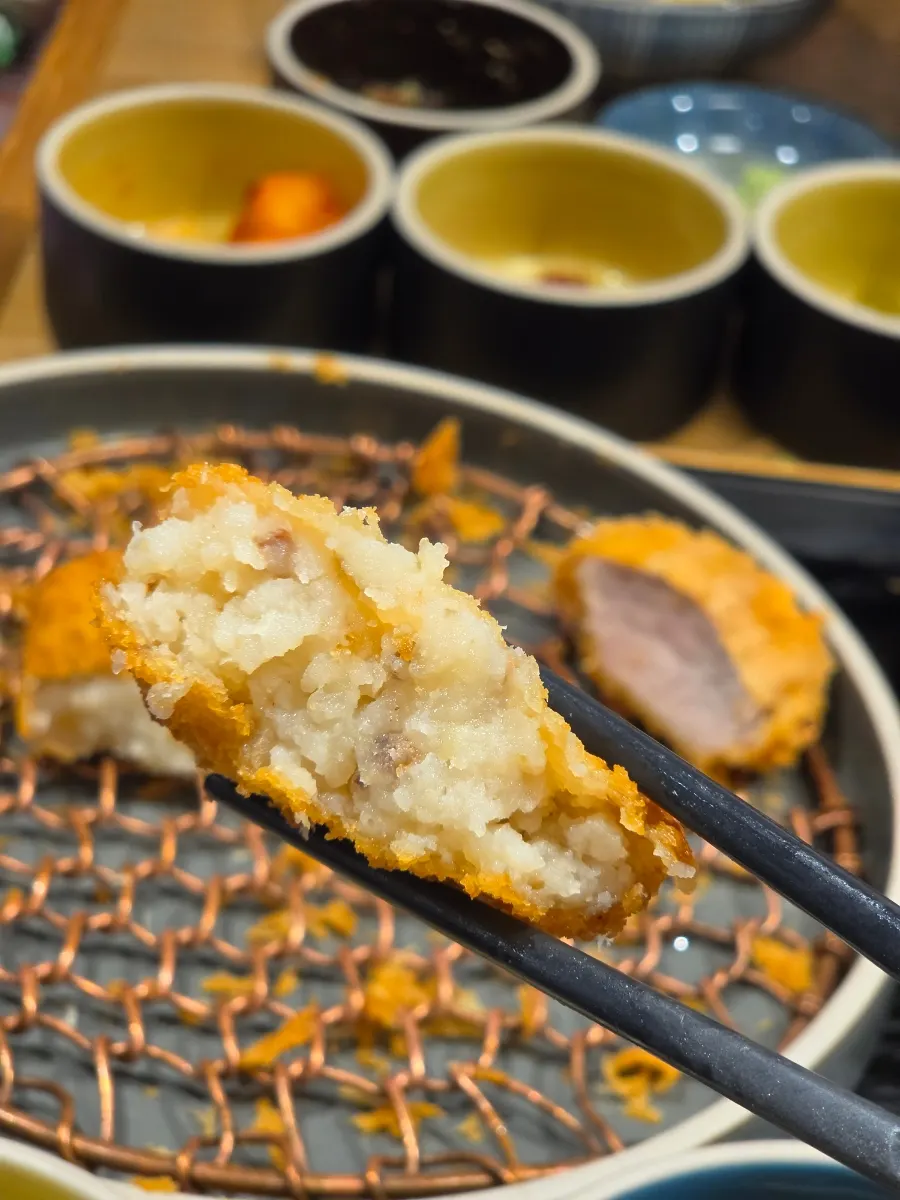 Cross-section of a freshly fried potato croquette