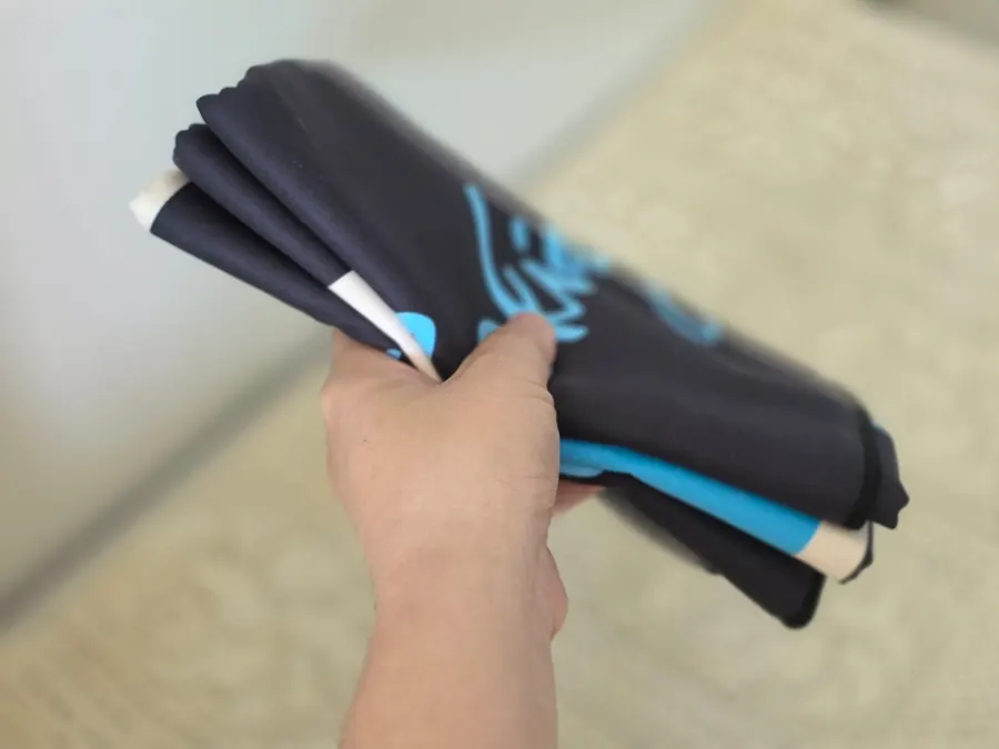 Colorful beach towel hung indoors