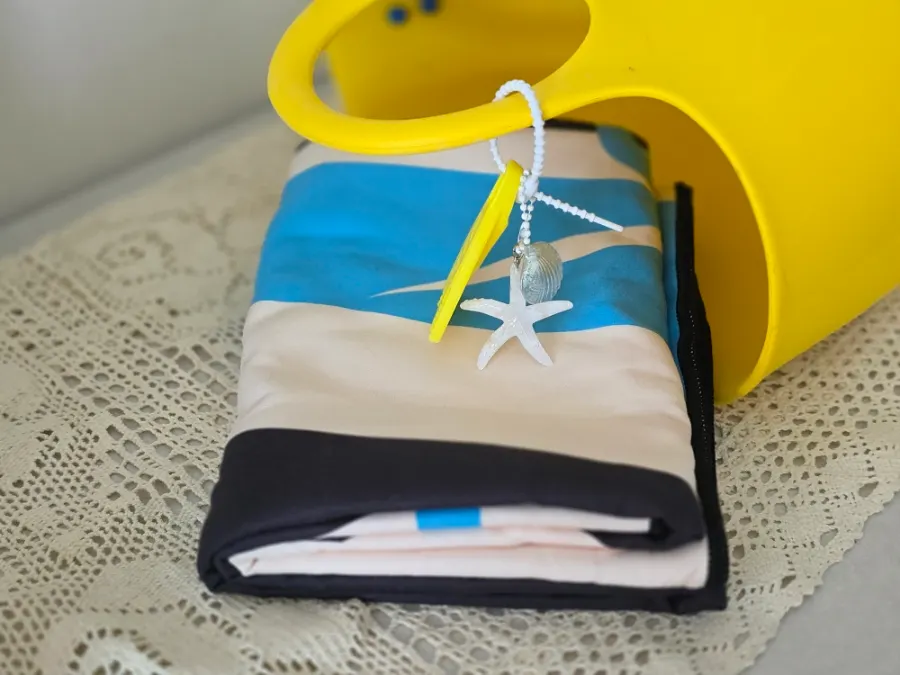 Beach towel packed for a small bag