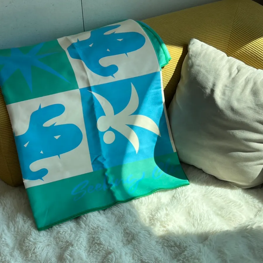 The green Lifeclue Beach Towel chosen by the writer