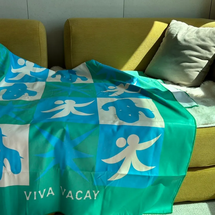 Green beach towel used as a décor item