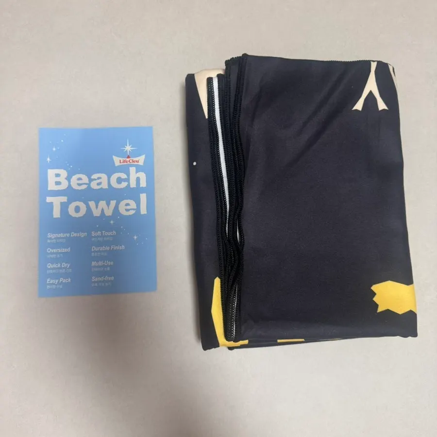 Lifeclue beach towel in a thick clear plastic bag