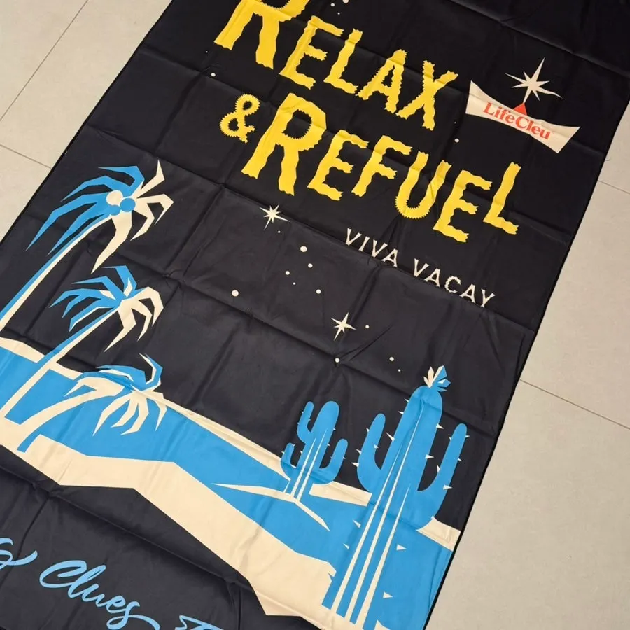 Lifeclue black beach towel with an unusual print