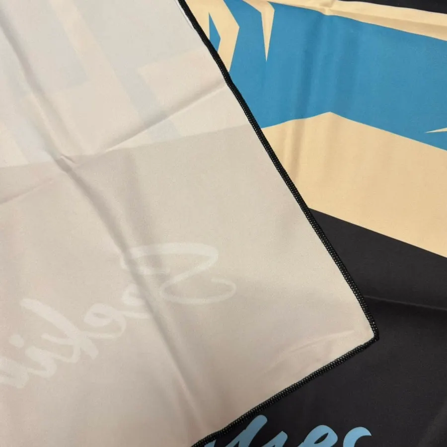 Soft beach towel fabric checked against bare feet
