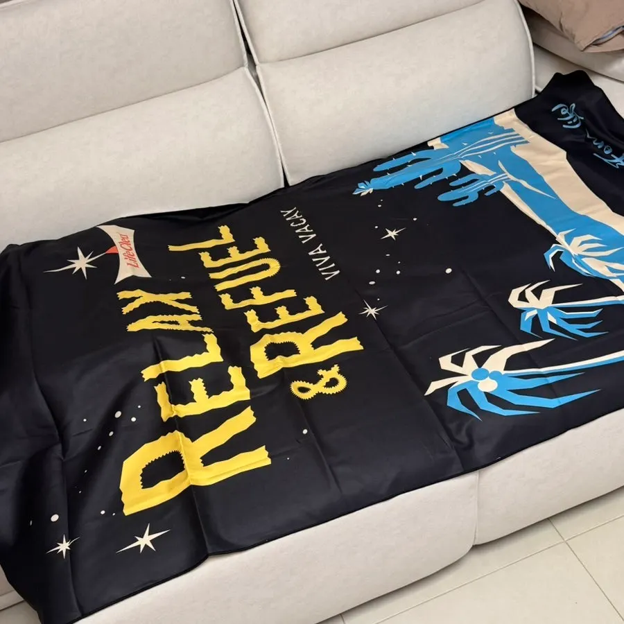 Beach towel spread over a sofa as a décor piece