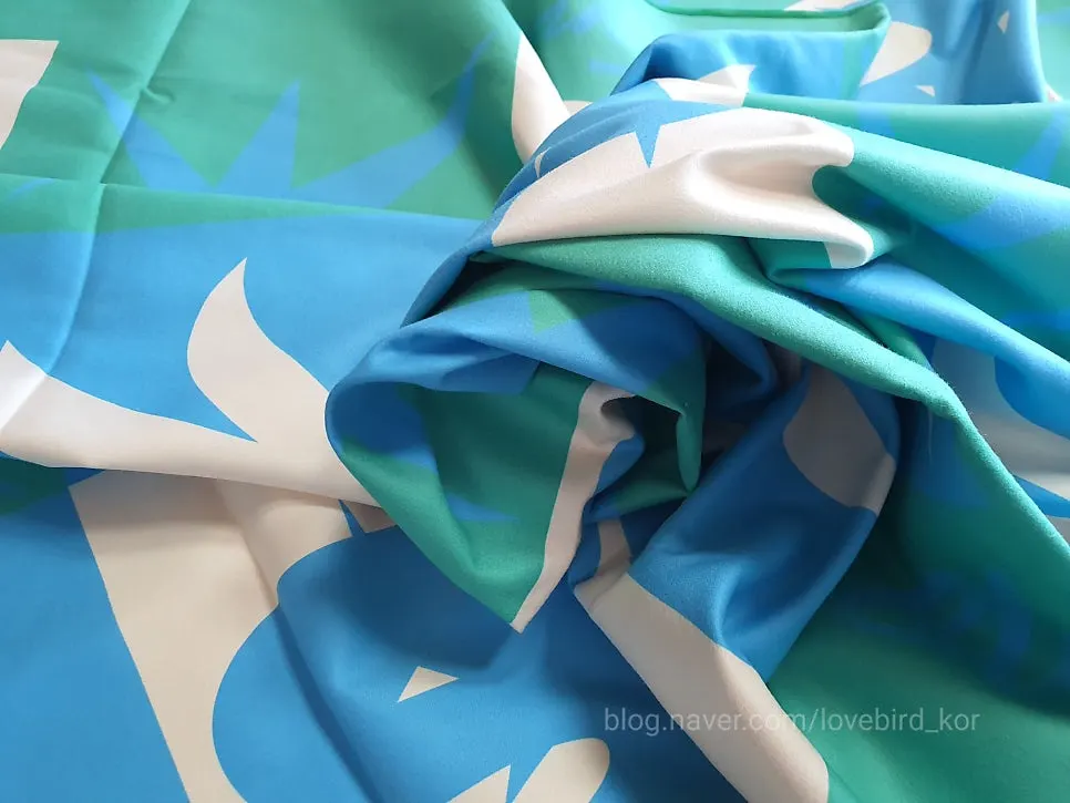 Large beach towel used as a bath towel and a travel cover
