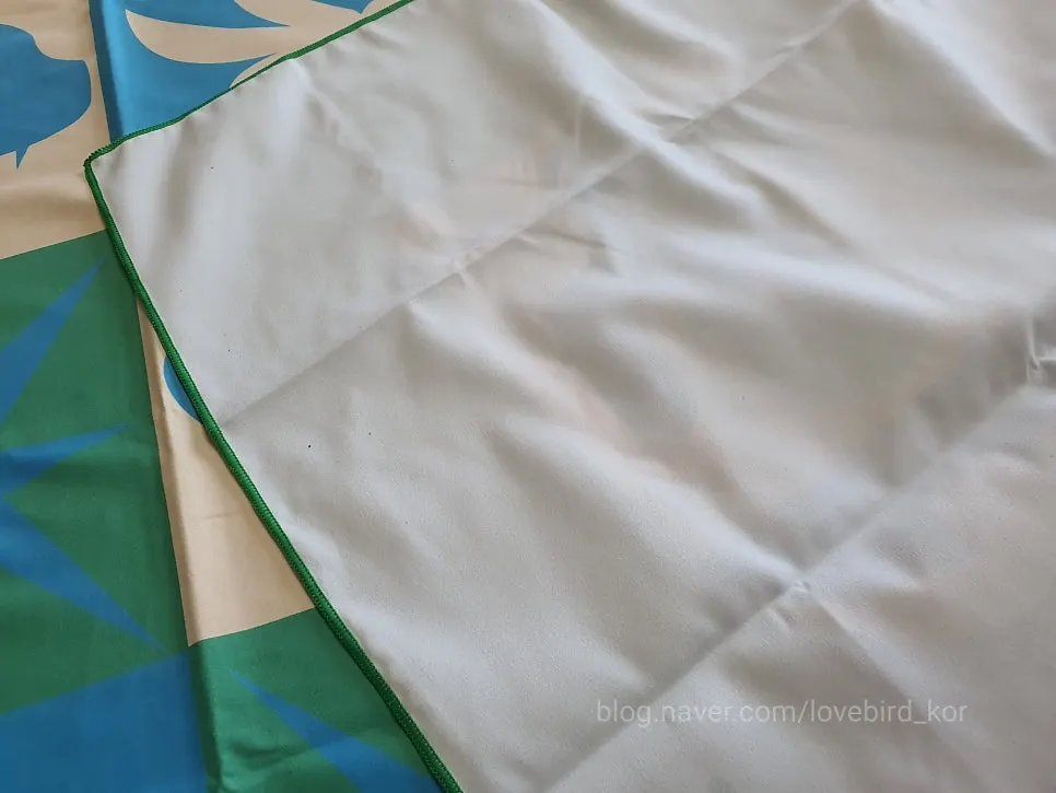 Overlock stitching along the edge of the Lifeclue Beach Towel