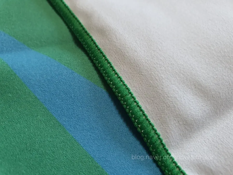 Beach towel edge inspected after use