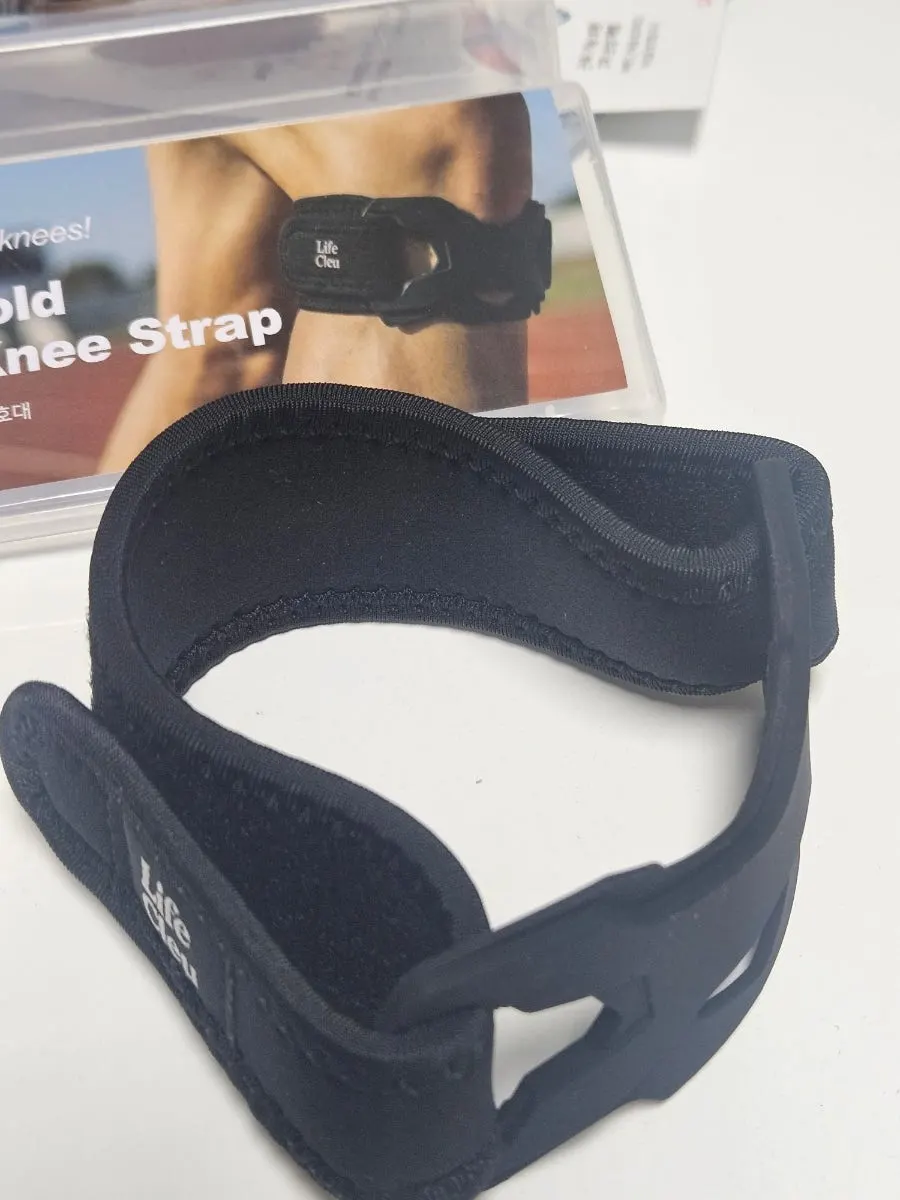 Silicone pad on the knee brace that wraps around the patella