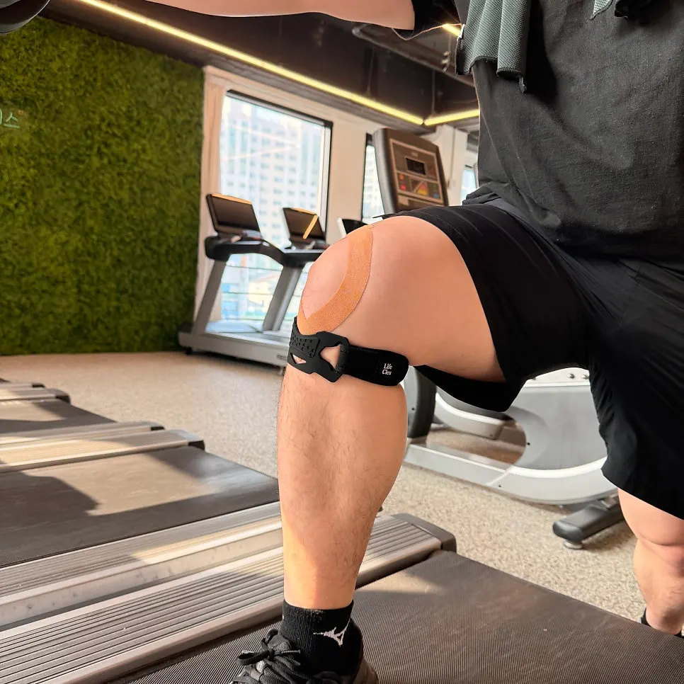 Getting ready to exercise after putting on the knee support at the gym