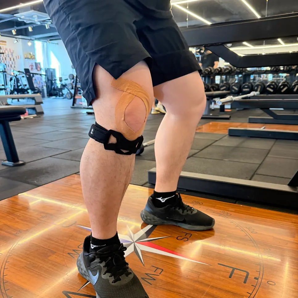 My husband's knee support while he squats