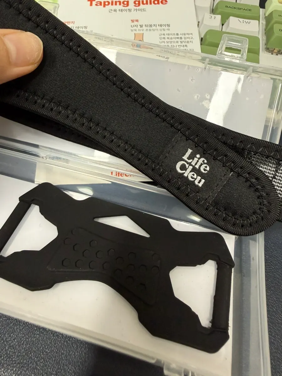 Knee taped around the joint before wearing the Lifeclue Powerhold brace