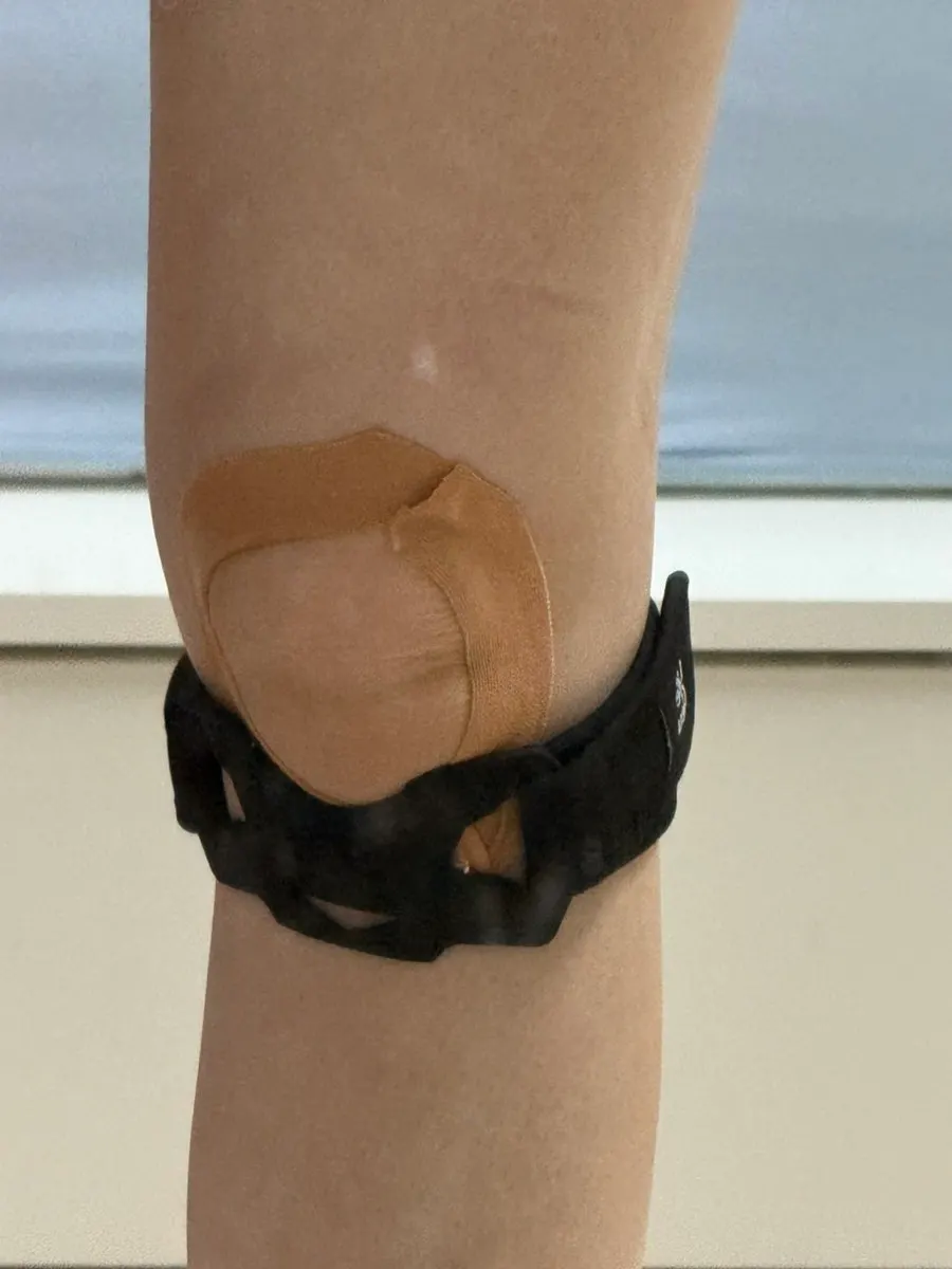 Lifeclue Powerhold brace worn over knee tape
