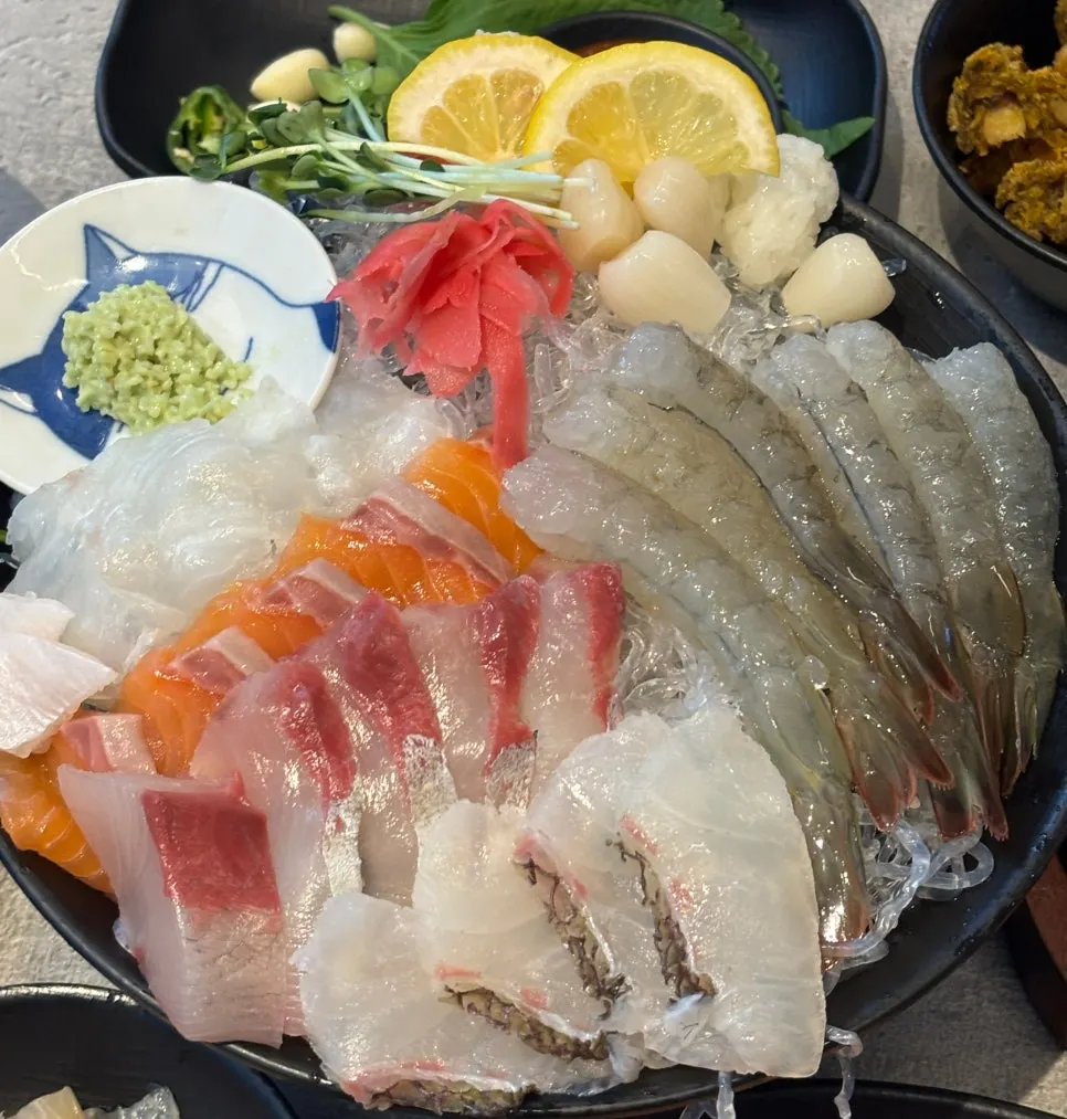 Four kinds of aged sashimi: flounder, salmon, yellowtail, red seabream