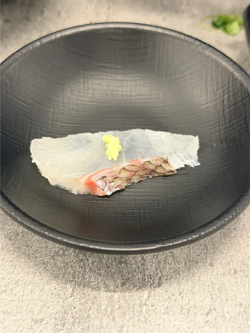 Glossy aged sashimi next to plump raw shrimp