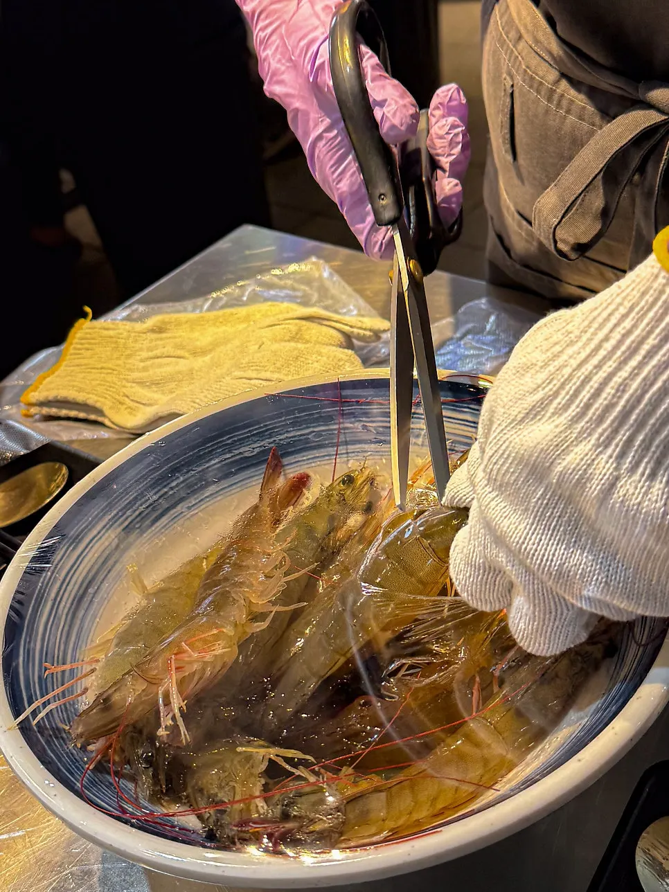 Cotton and hygiene gloves for prepping raw shrimp sashimi