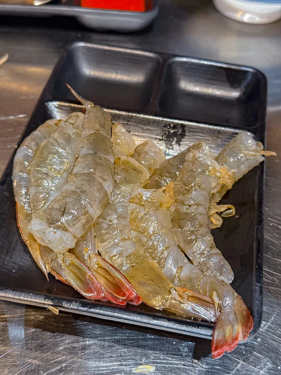A plate of live fall raw shrimp
