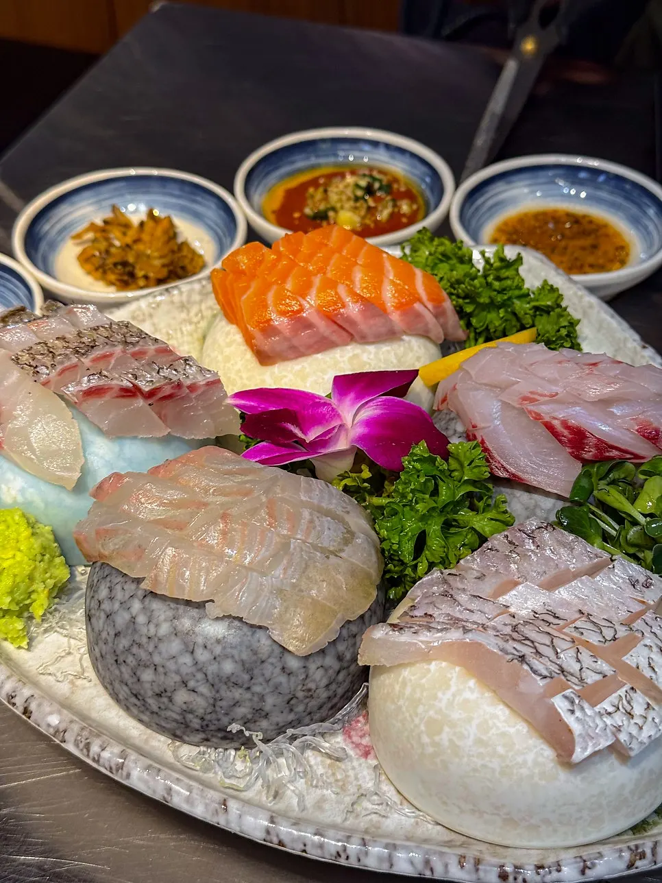 A plate of mini seasonal assorted sashimi
