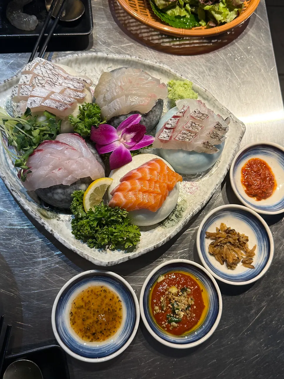Assorted sashimi platter with mullet, flounder, salmon, and red seabream