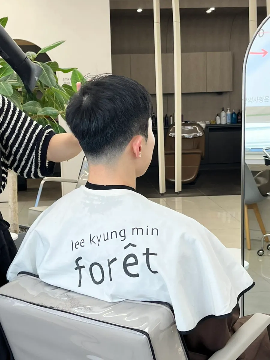 Hair being tidied up during the cut