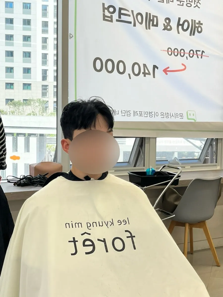 Checking length while trimming during the men's haircut