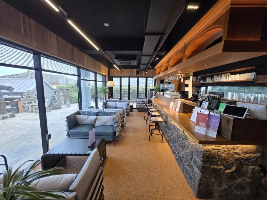 First-floor counter blending wood and stone-wall texture