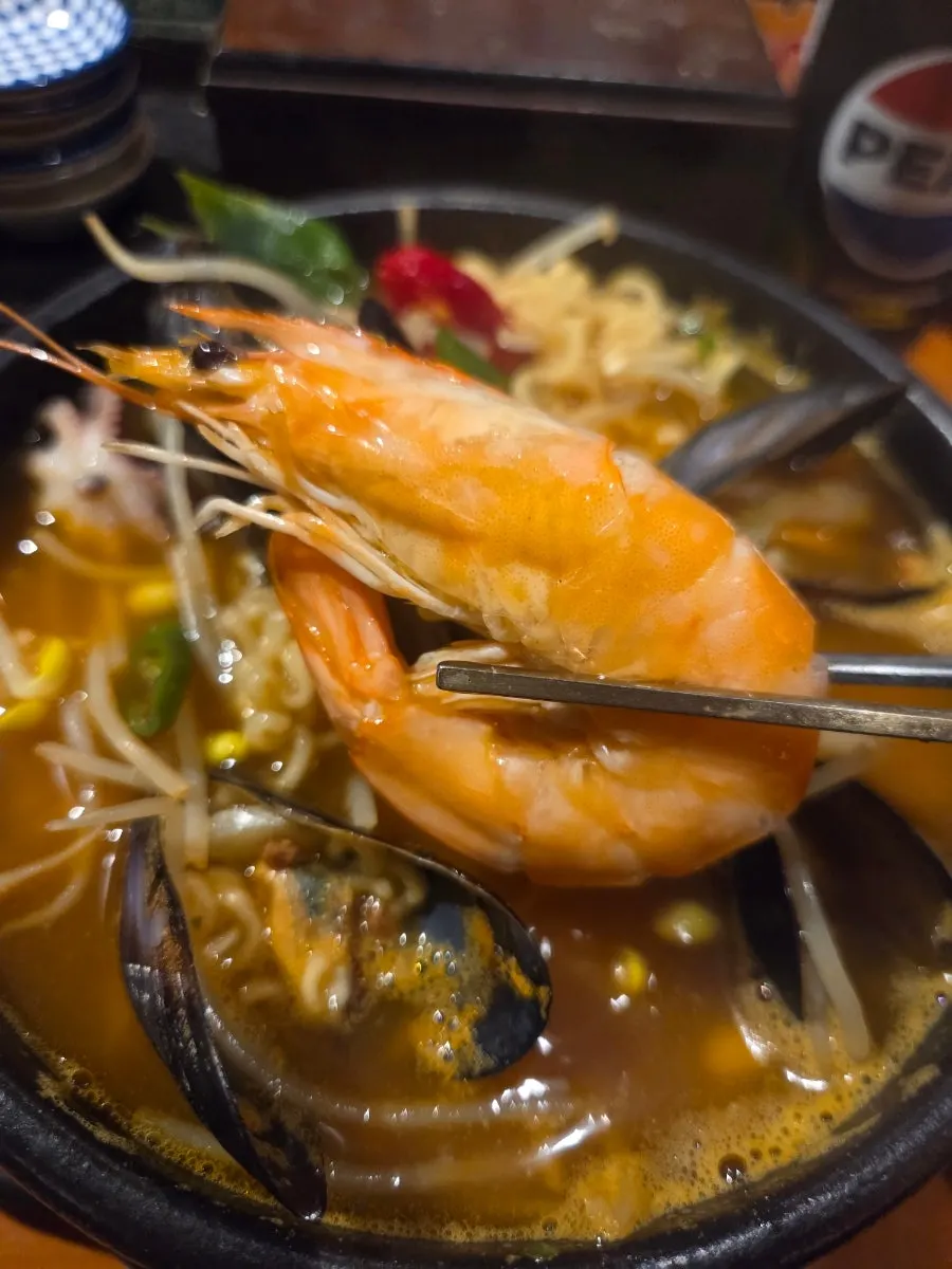 Shrimp and mussels visible in the seafood ramyeon