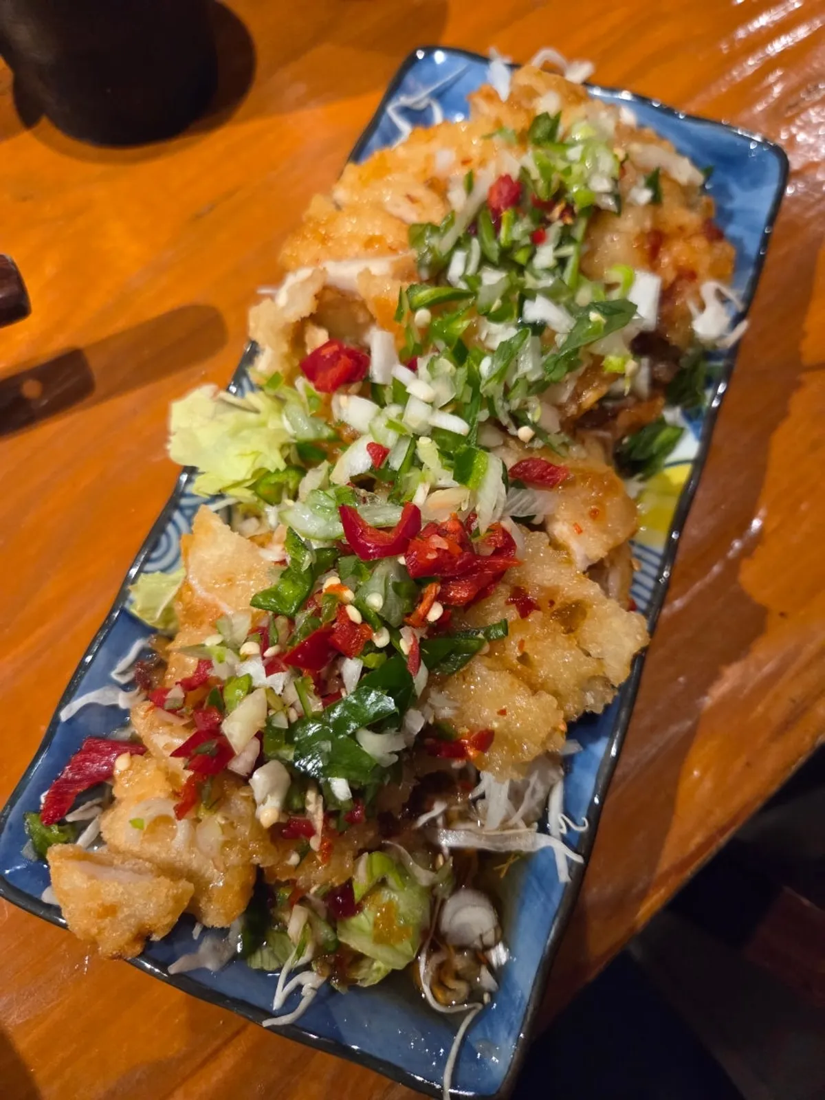 A plate of yurinki topped with tangy sauce