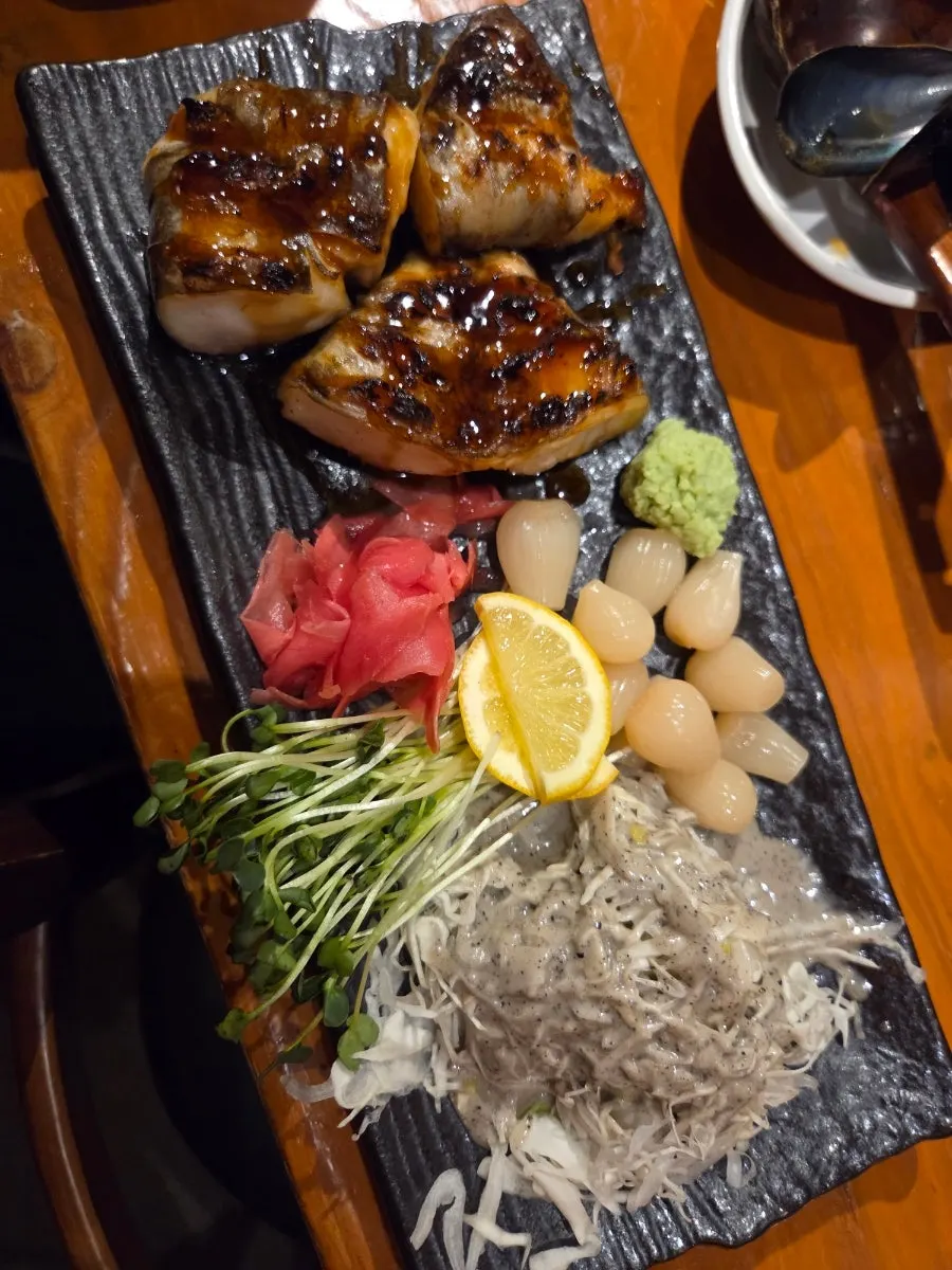 A plate of grilled toothfish cooked over open flame