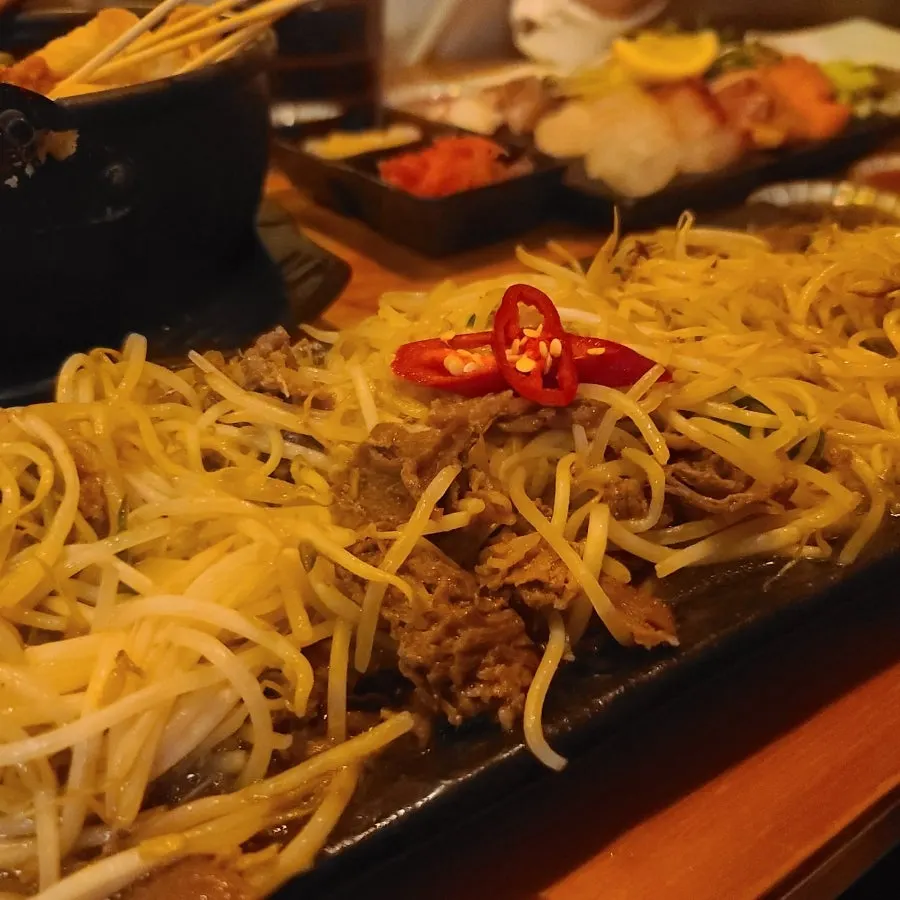 Close-up of smoky beef brisket bean sprout stir-fry