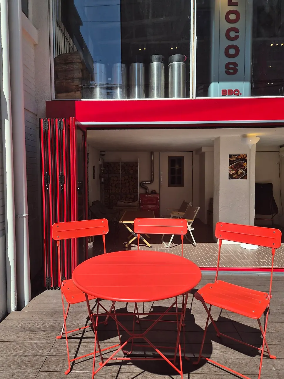 1st-floor outdoor seating decorated with camping props